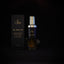Luxurious high end body moisturizer with black and gold packaging and floating 24k gold.