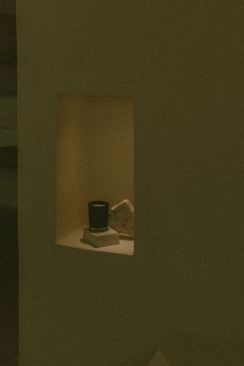 UMM Skincare's jasmine scented candle creating an elevated holistic bathing experience.