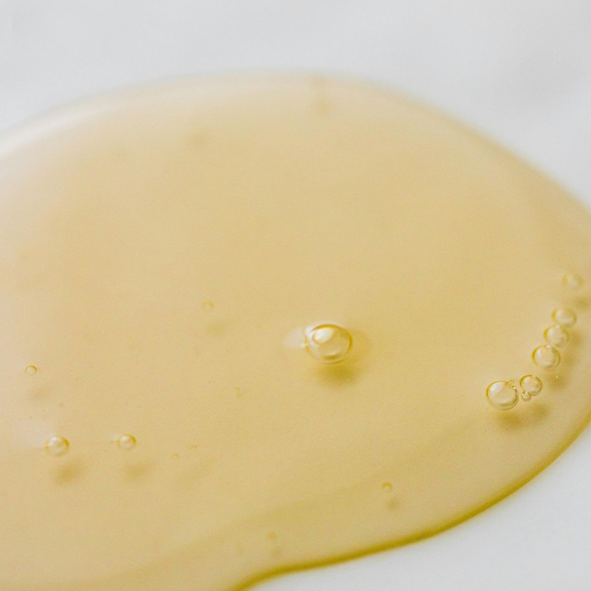 Pure yellow Amla oil used to promote natural skin hydration.