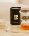 UMM Skincare Ayurvedic loose leaf tea in the packaging and being brewed for relaxing self-care.